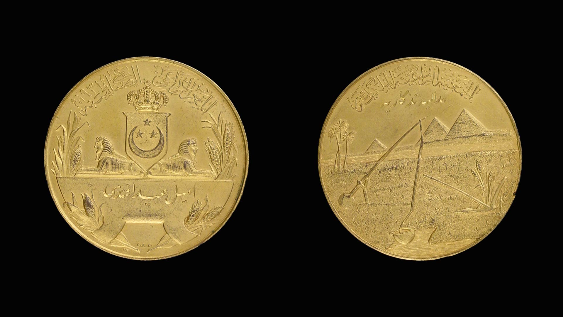 the front and back of a golden medal with engravings on it