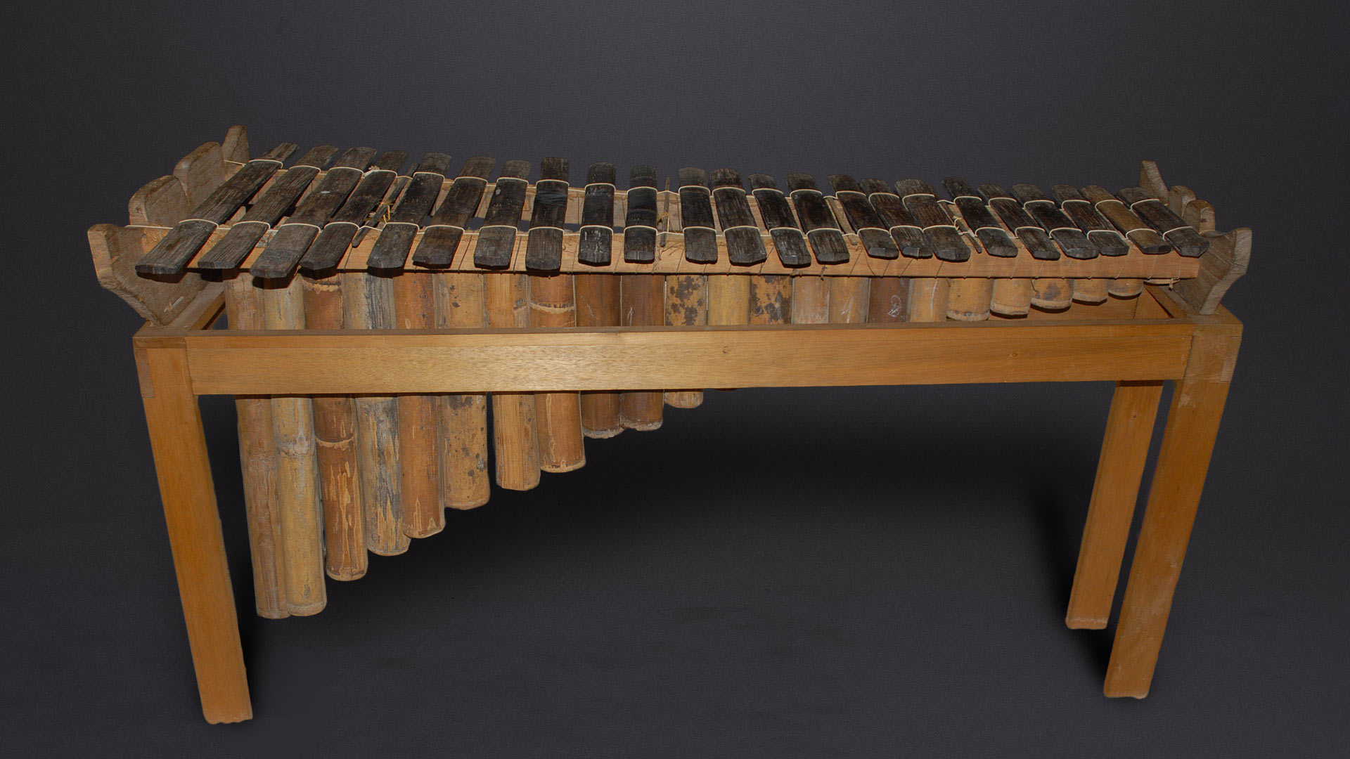 large all wooden marimba with standing wooden frame
