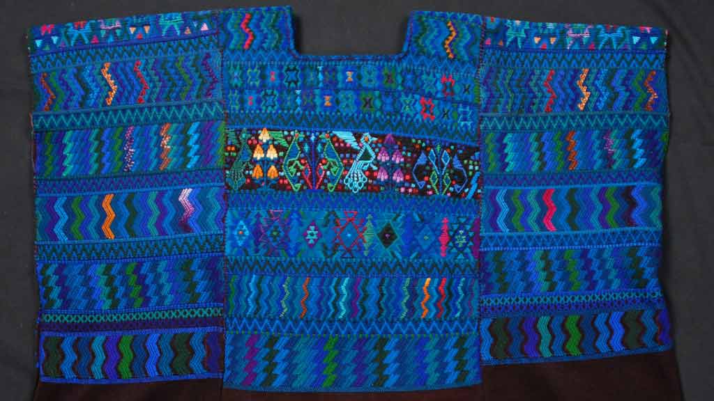 Brilliant blue huipil textile with geometric squiggly line pattern