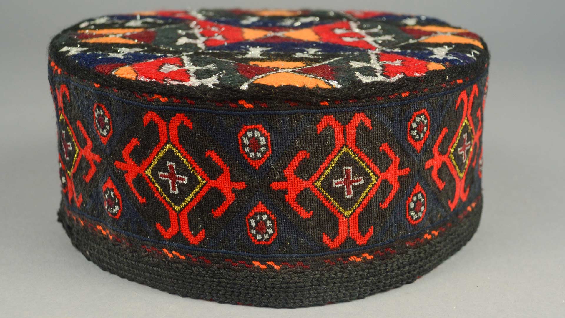 multicolored embroidered cylindrical hat