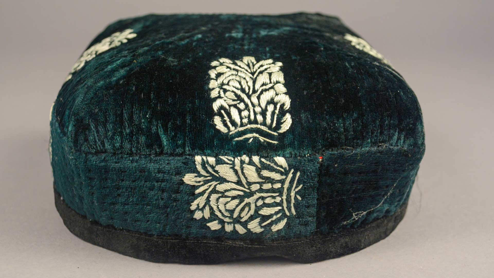 green velvet hat with white embroidery