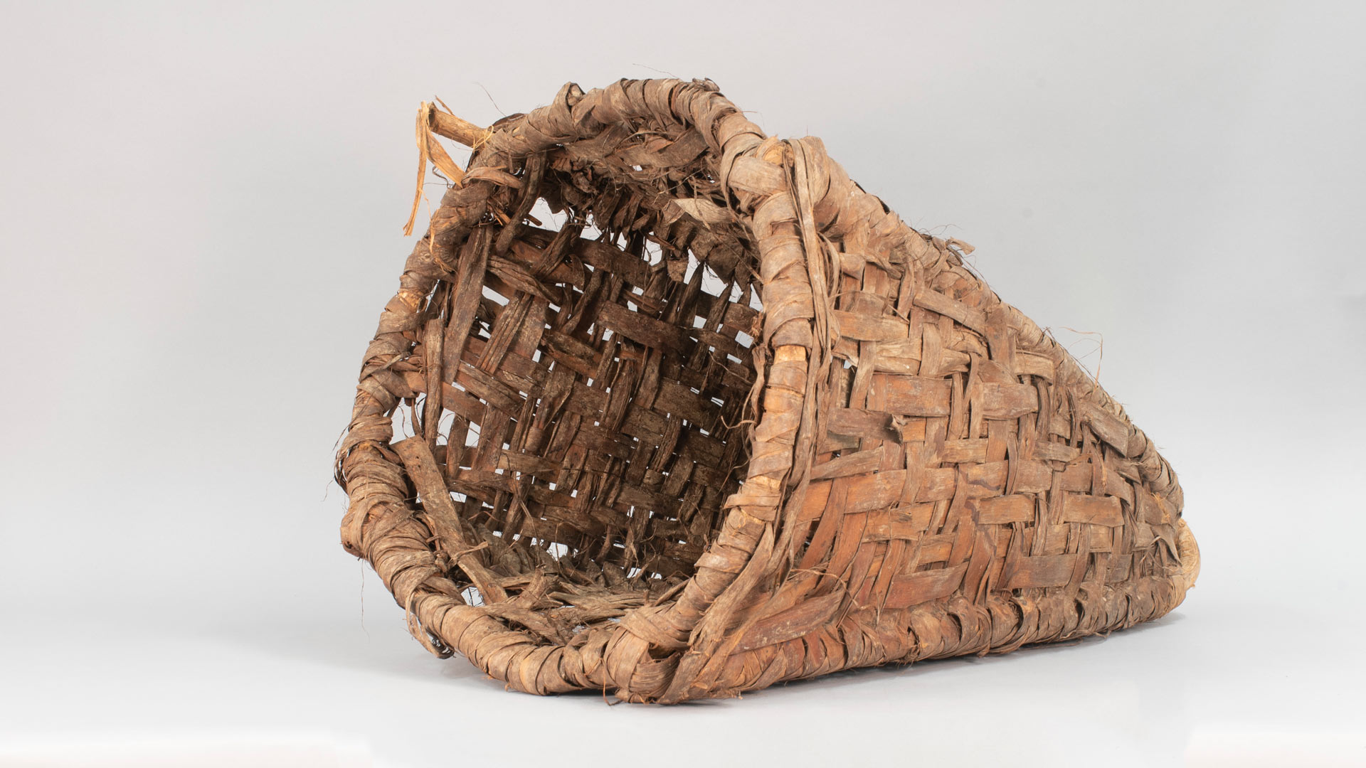 brown woven basket with a slight pointed end