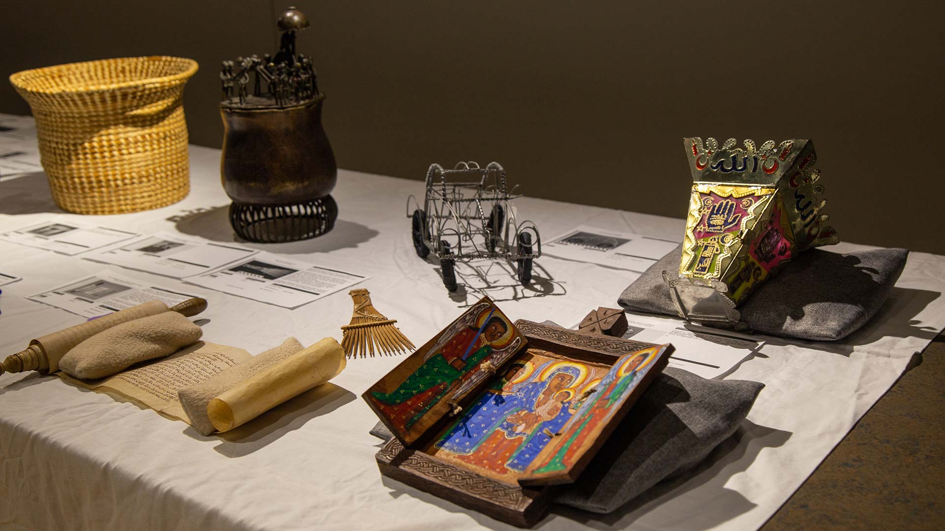 A table of objects from africa with printed documenation