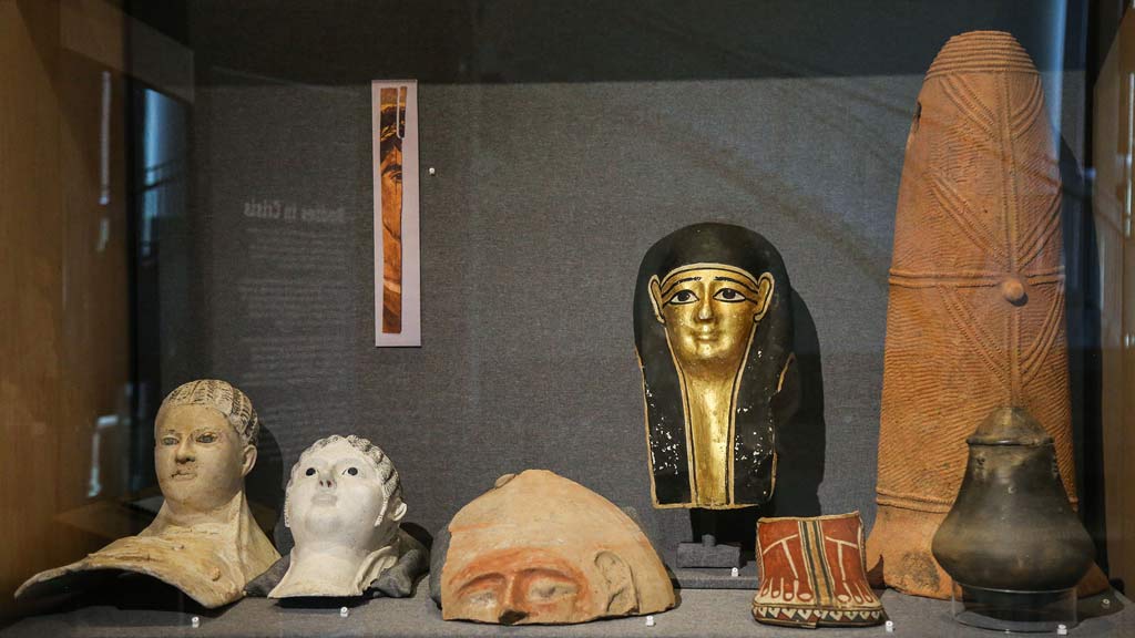 Display case containing artifacts related to the death portion of the exhibit