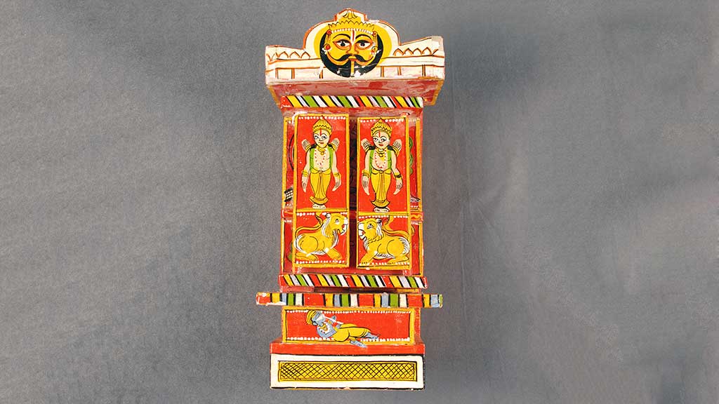 painted wooden box with doors and red and yellow designs