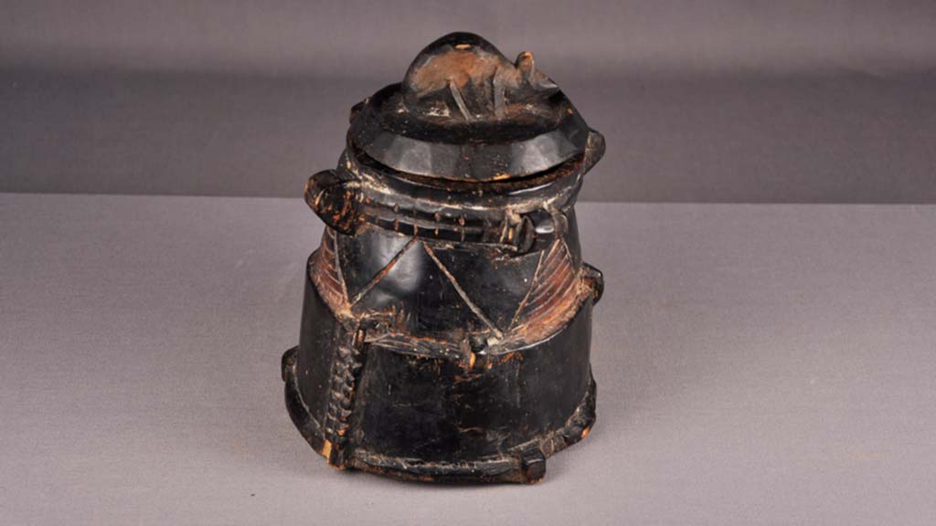 wooden black container with lid and carved mouse on top