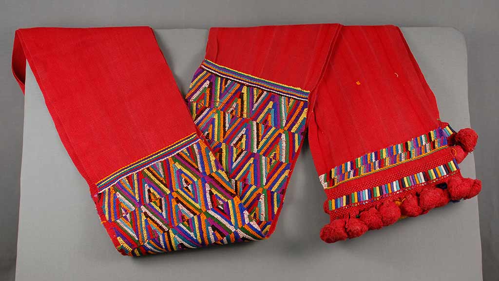 long red cloth with geometric band in the middle and the ends
