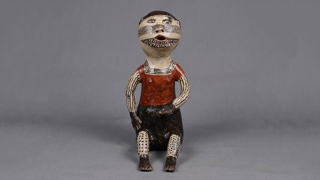 ceramic seated figure