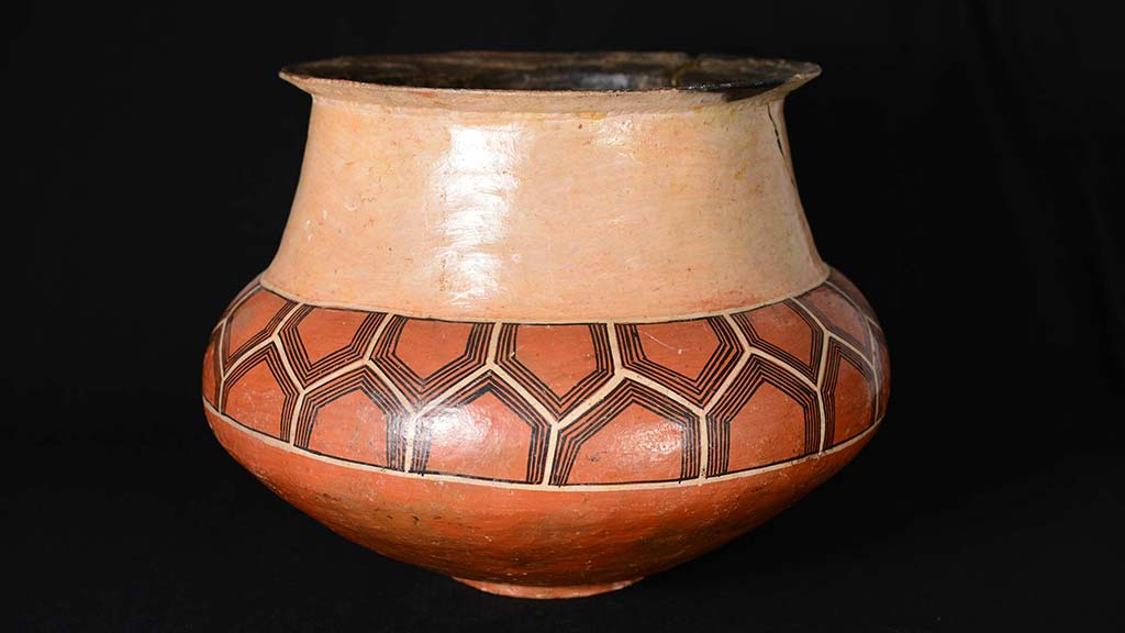 large ceramic vessel with geometric design around the middle