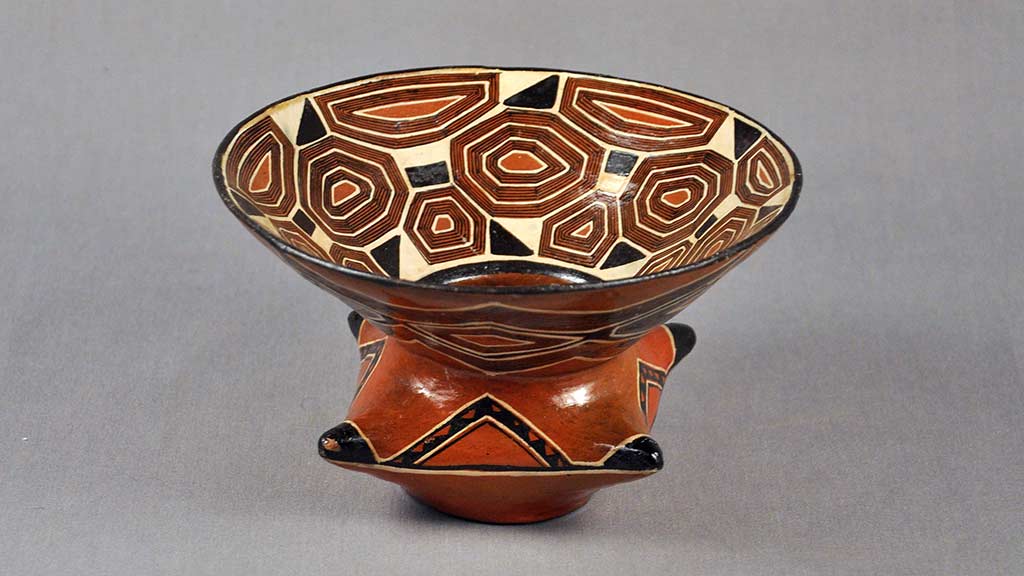 ceramic bowl with geometric design and a 4-pointed base