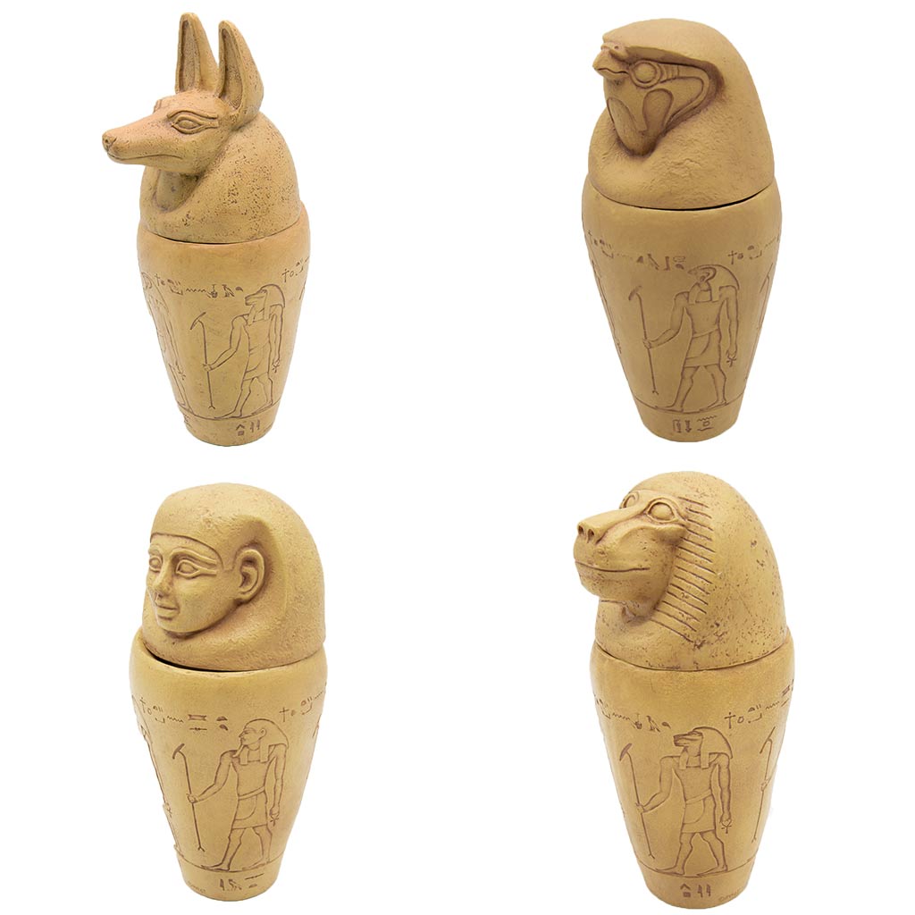 Four jars with different lids depicting a jackal, falcon, human, and an ape