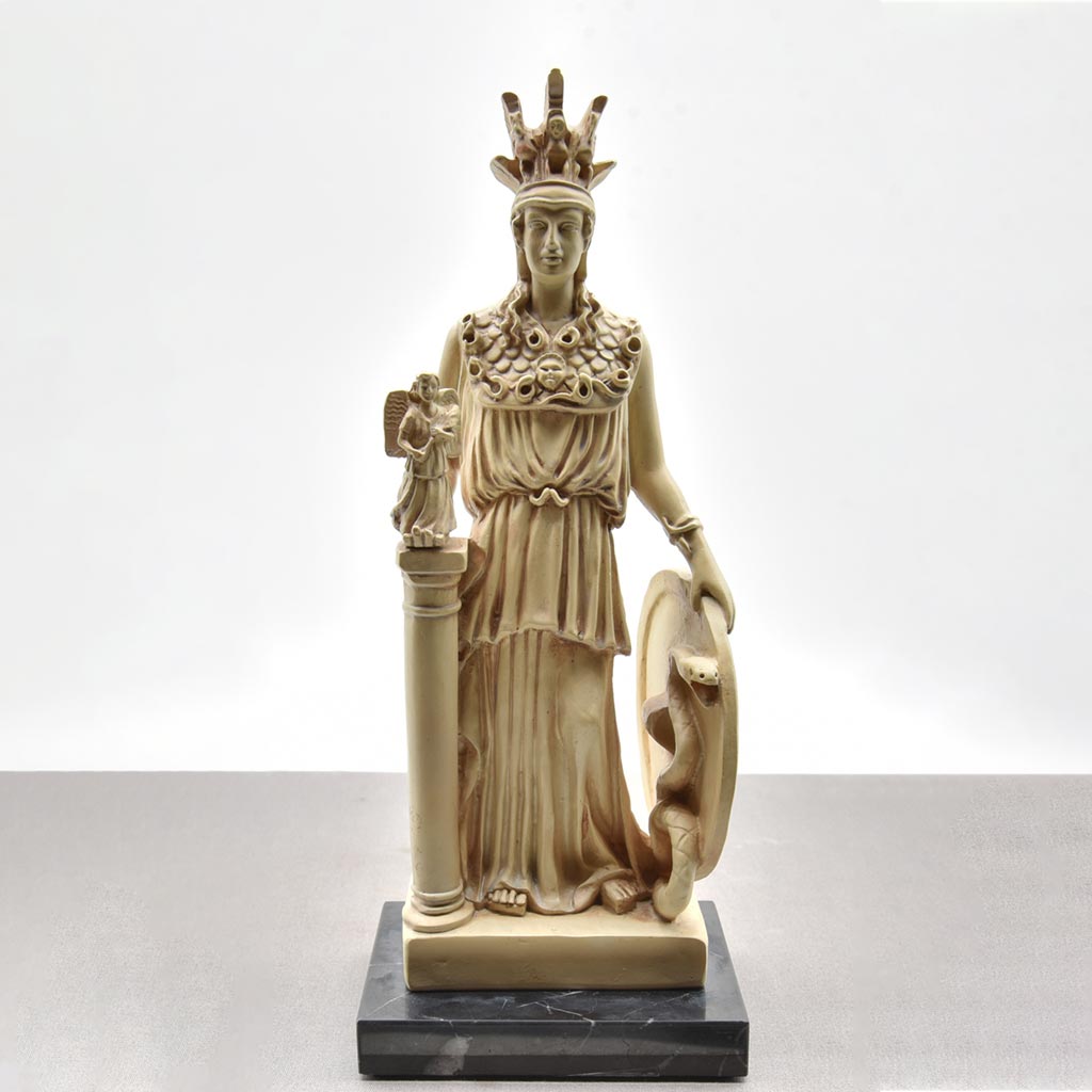 a gold, wood, and ivory statue of Athena holding medusas head and holding a shield with a serpant on it