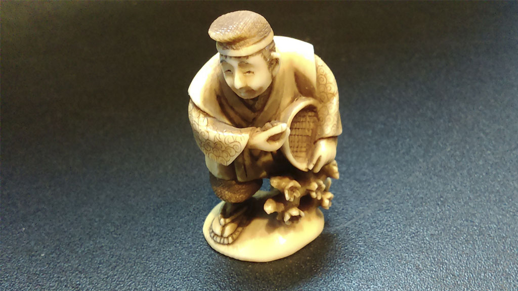 a figurine of a farmer