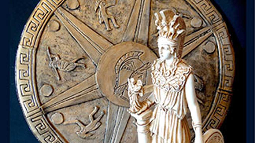 picture of golden shield and statue of a god
