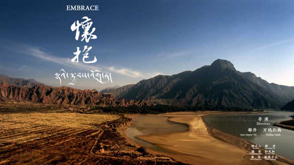 Promotional photo: barren mountain landscape with bright blue sky