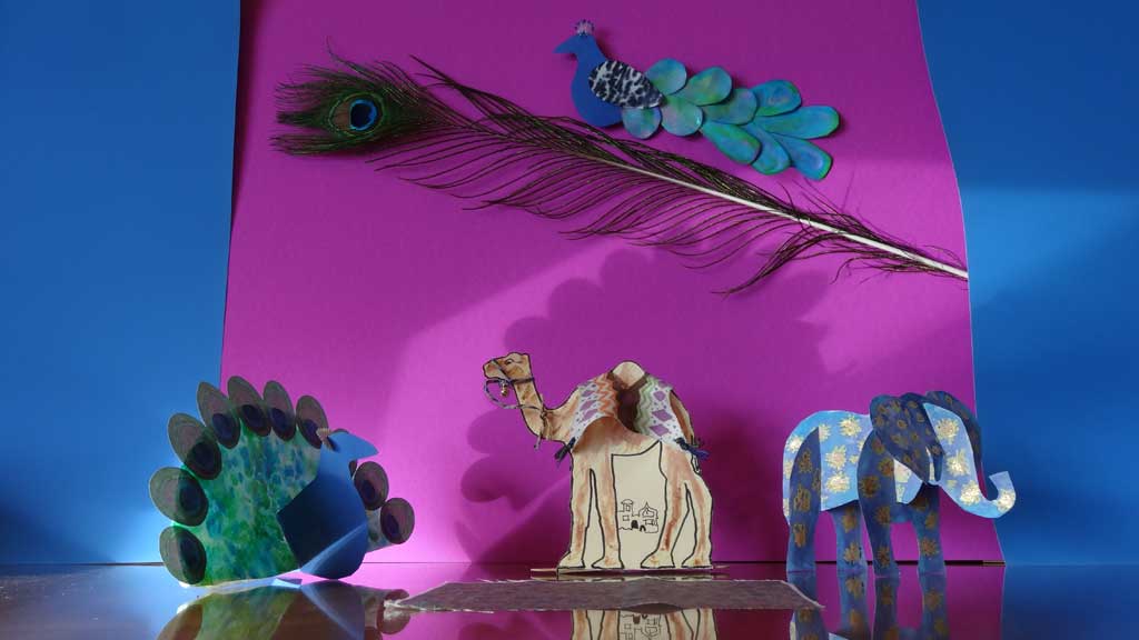 camel, peacock, and elephant paper crafts