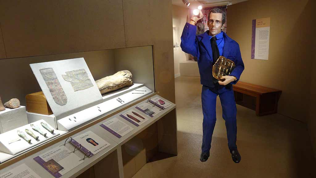 Security guard with tablet checking the Egypt exhibit