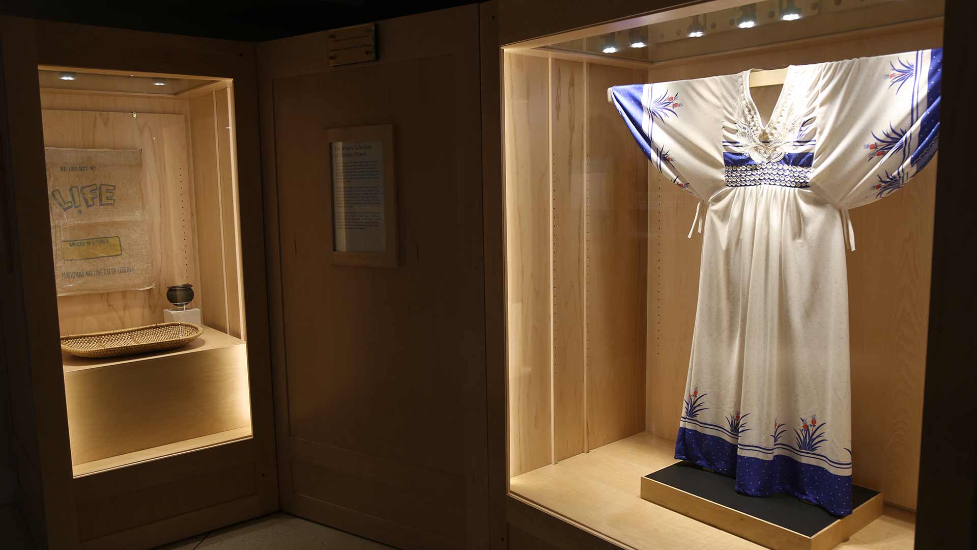 view of two cases holding objects from the Witalis Collection of Liberian Objects
