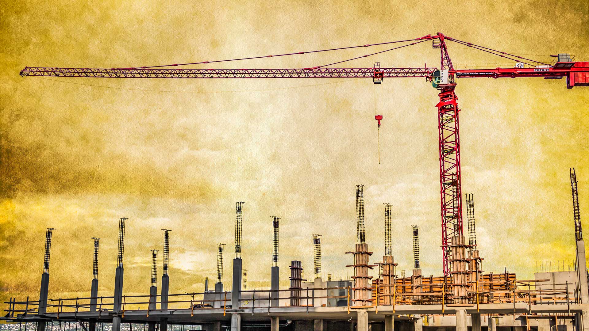 full view of a large construction crane over a construction site