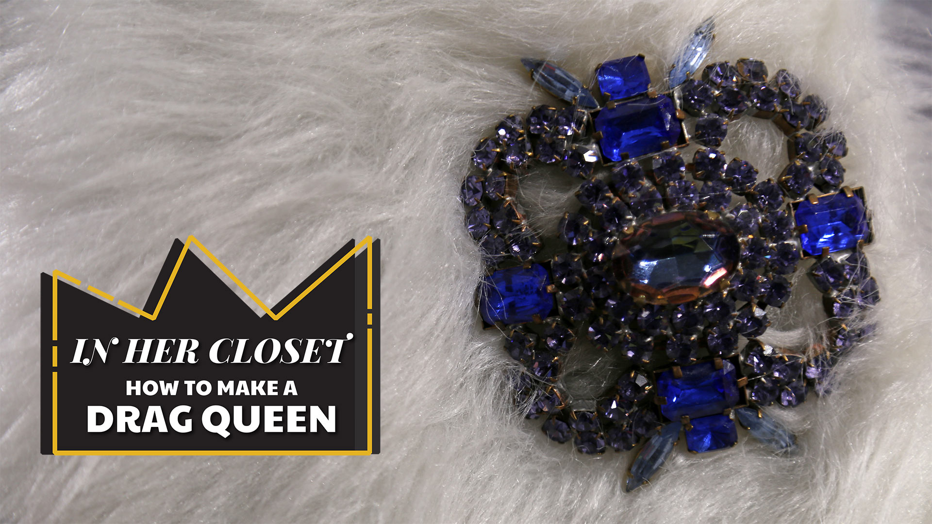 in her closet how to make a drag queen logo superimposed on white fur with blue gemstone brooch