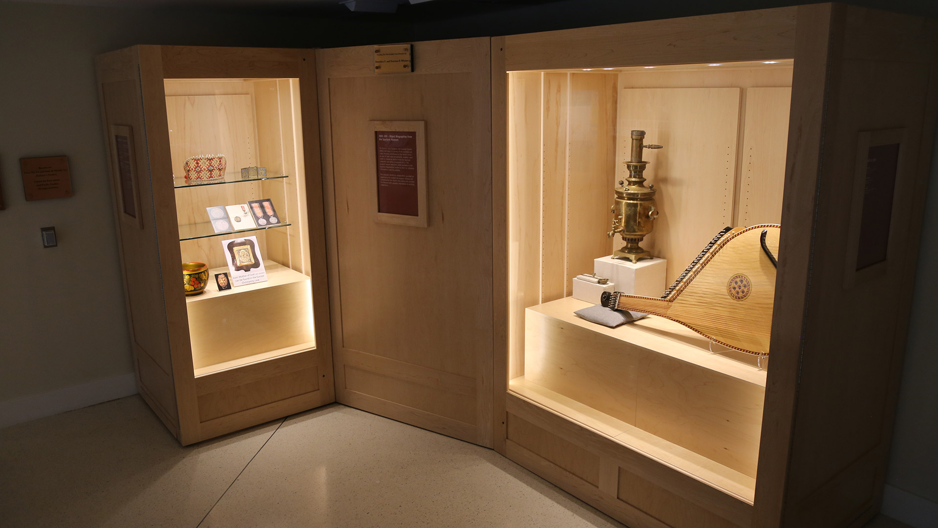 view of cases holding objects from REES 200 - Object Biographies from the Spurlock Museum
