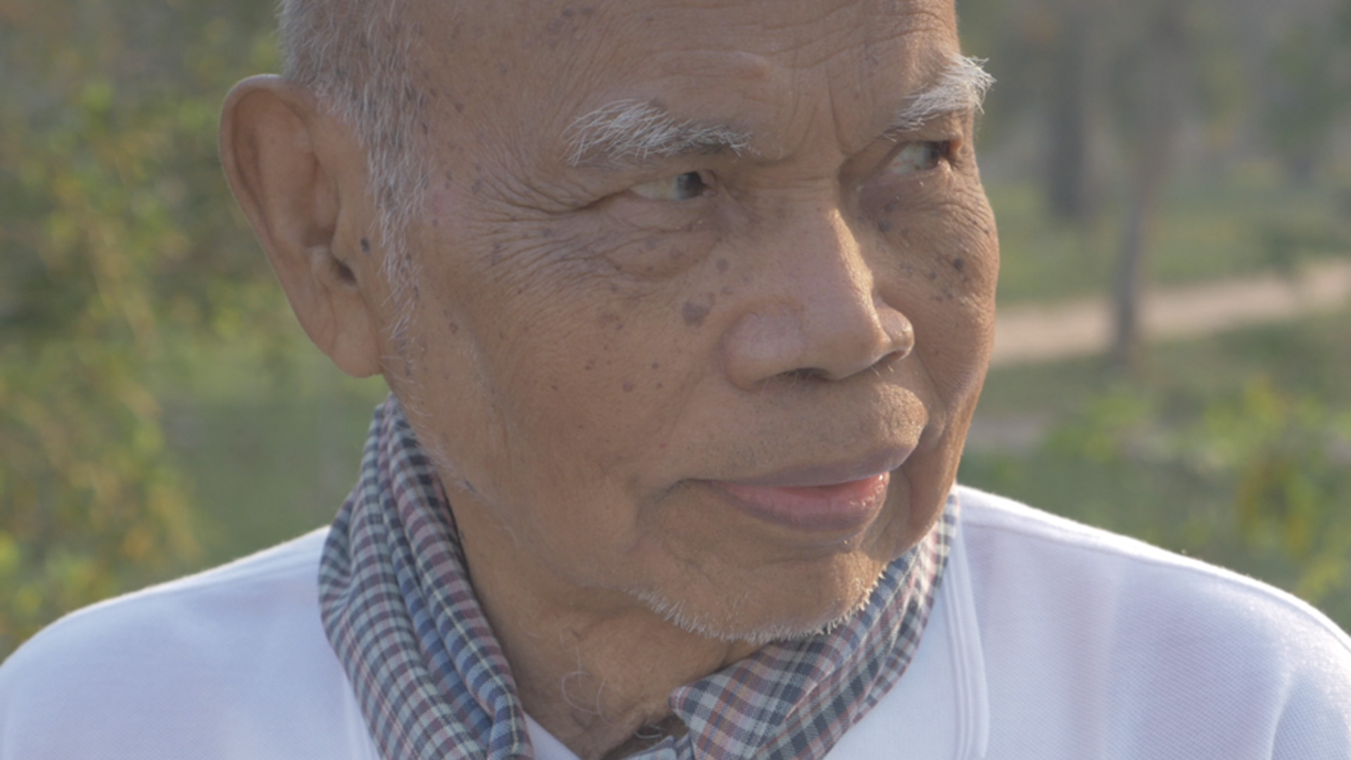 elderly man looking intensely to his left