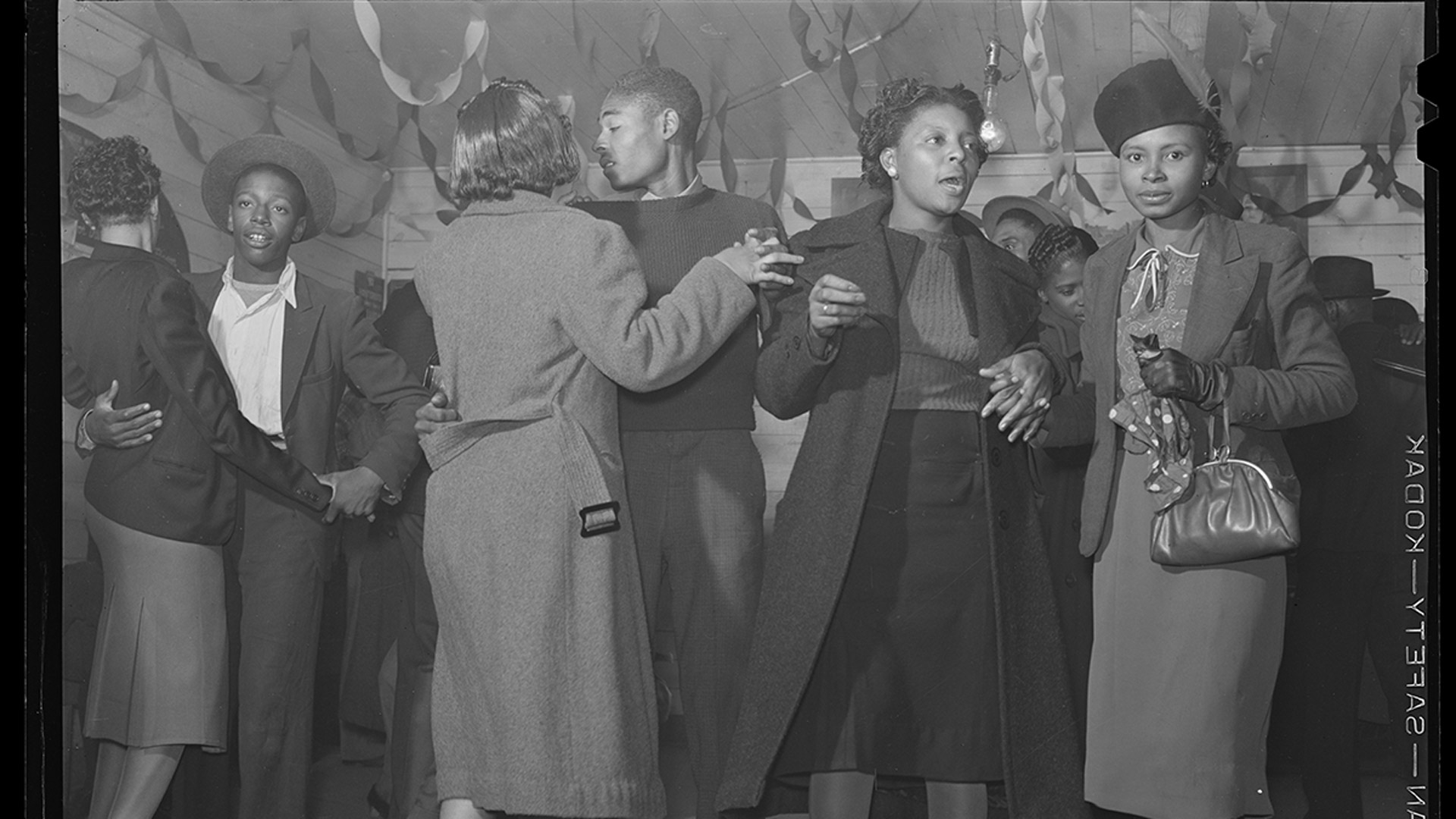 African American men and women dancing together.
