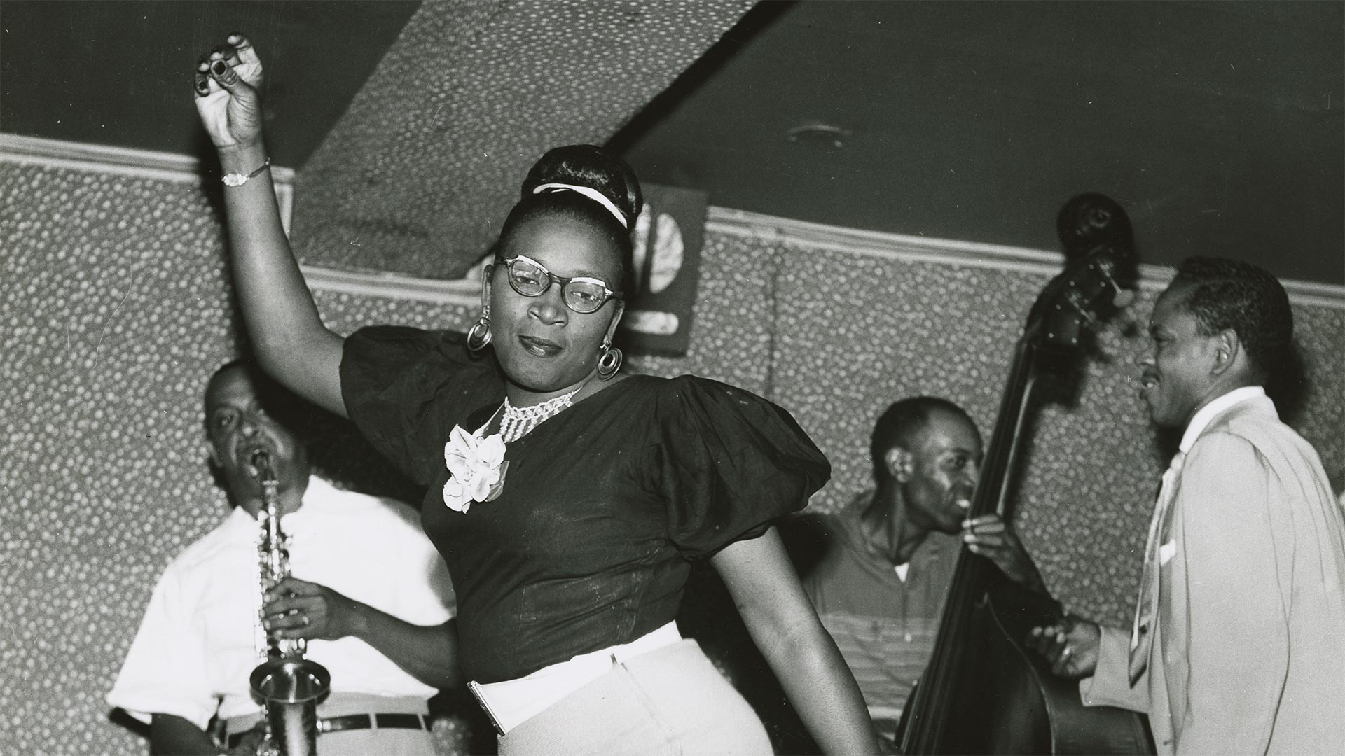 African American men and women dancing together.