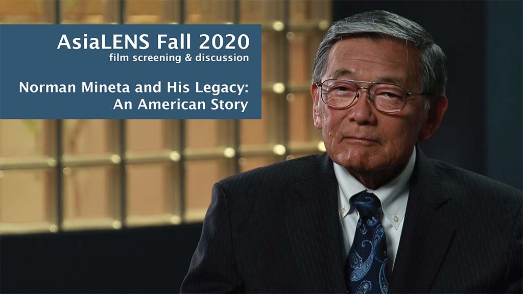 interview photo of japanese man in front of glass block wall