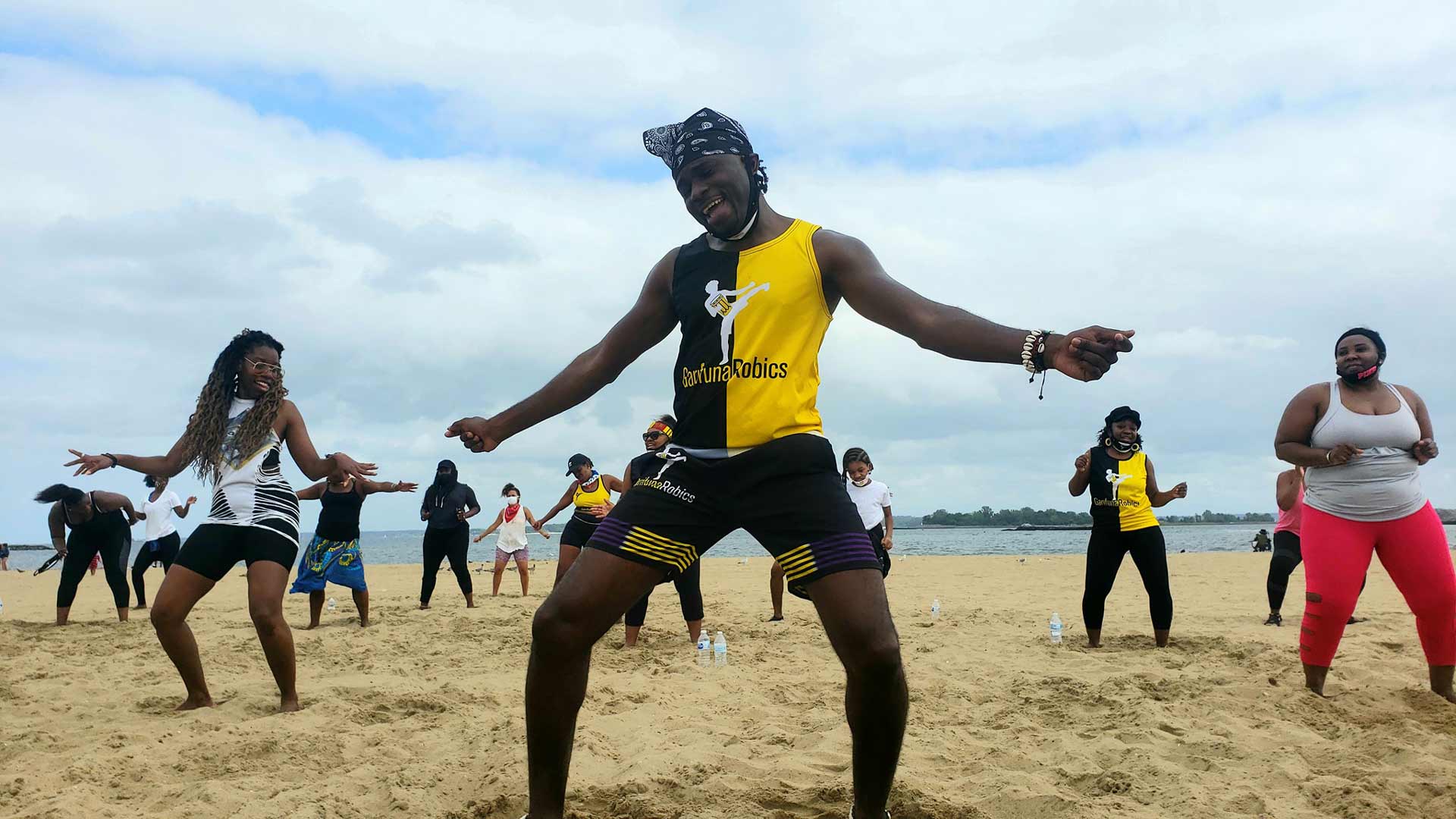 people dancing on a beach