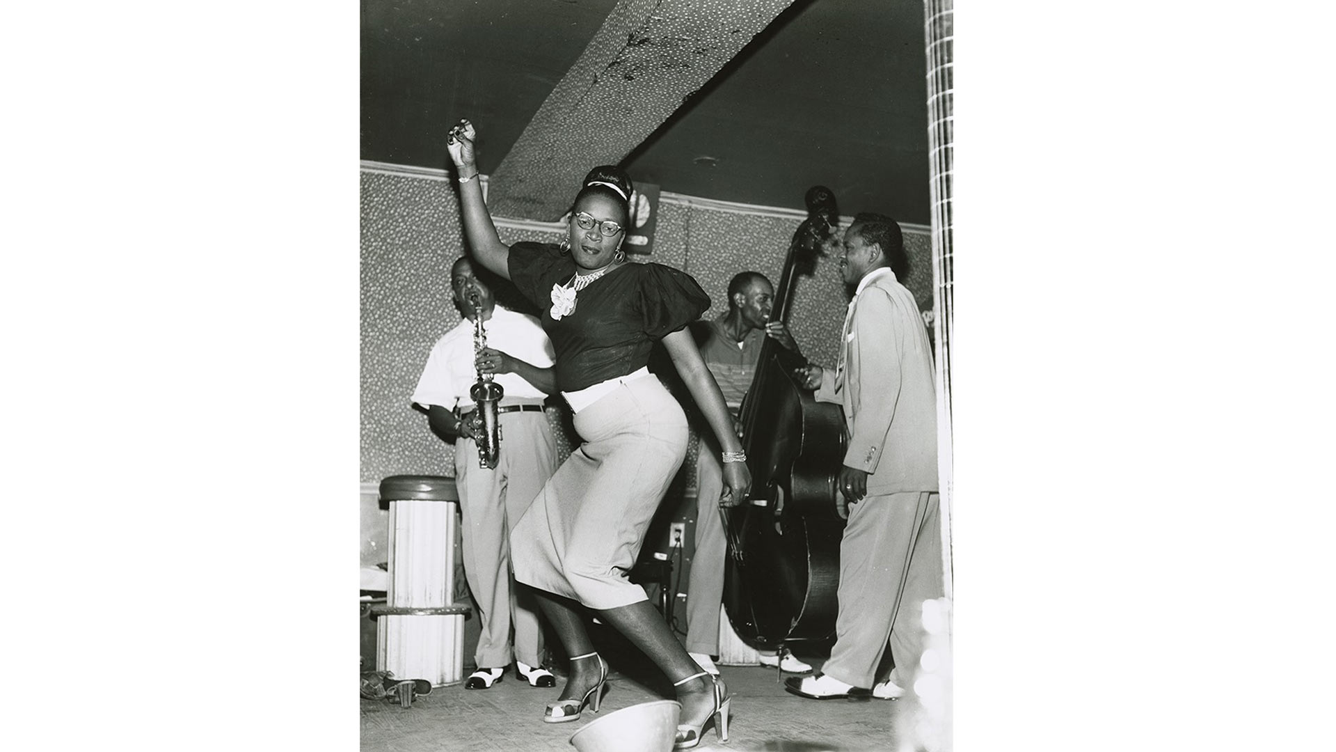 black and white photo of a woman dancing