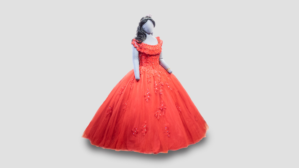 gray mannequin wearing a red, sparkly ball gown and black wig