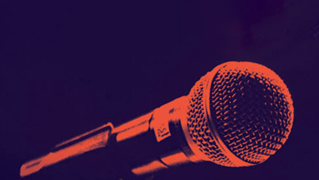 duotone image in dark blue and orange of a microphone 