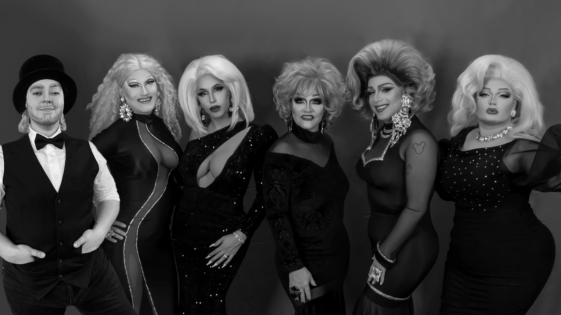 black and white photo of a group of 6 drag queens in full drag