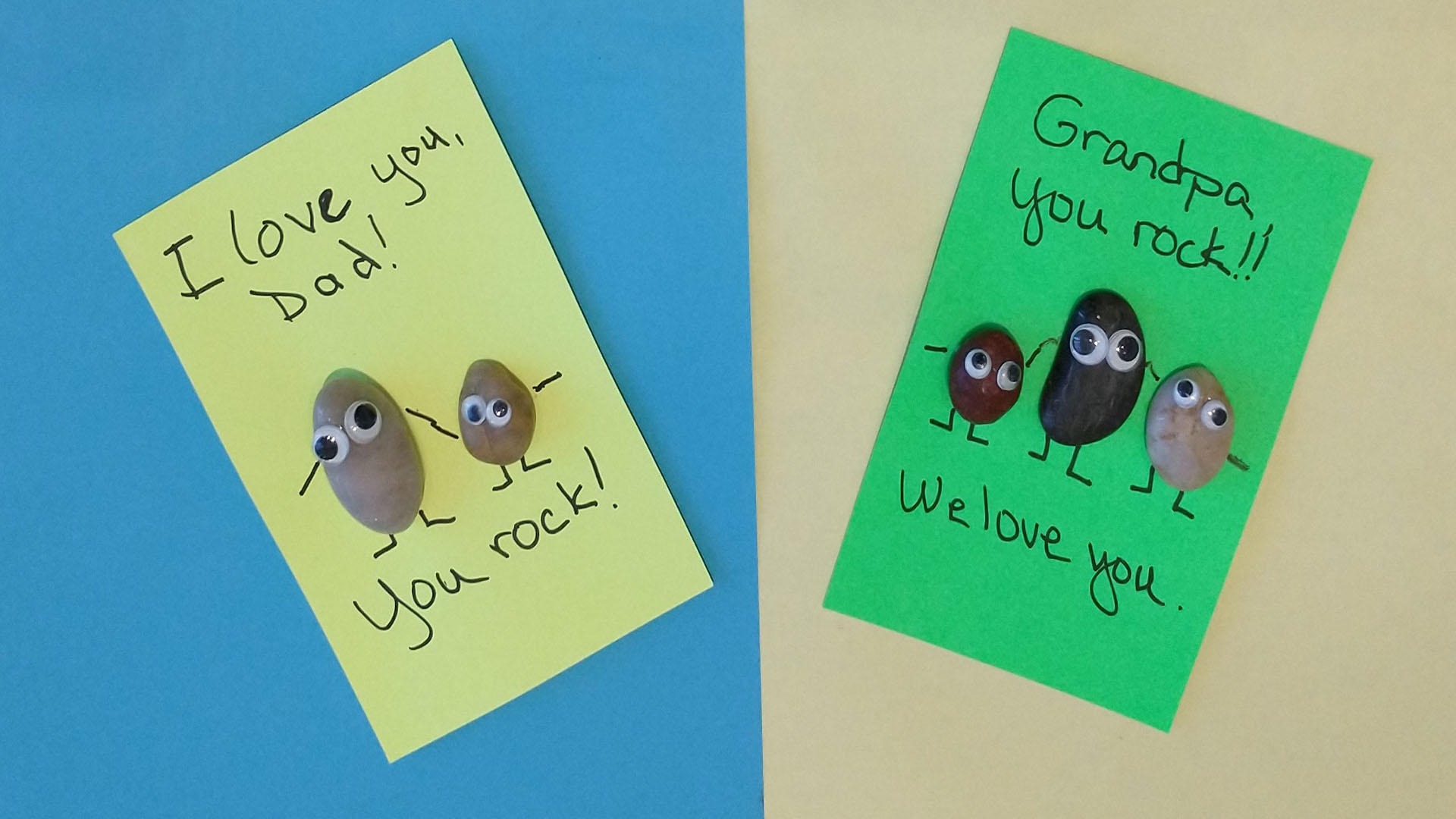 Two cards for dad and grandpa with rocks and googly eyes and text 