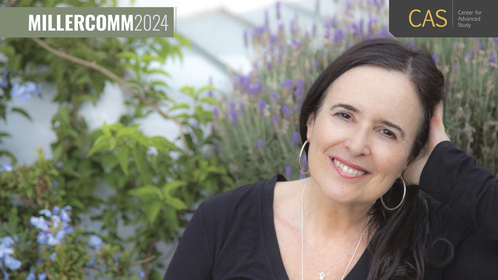 Ruth Behar smiling in front of flowers