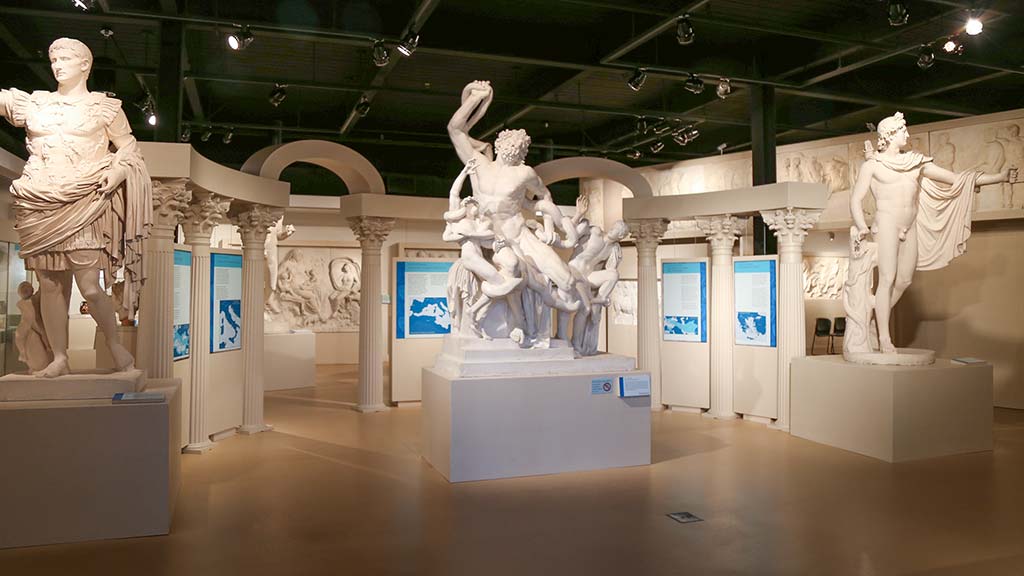 overview of the ancient Mediterranean exhibit with three large featured plaster cast statues
