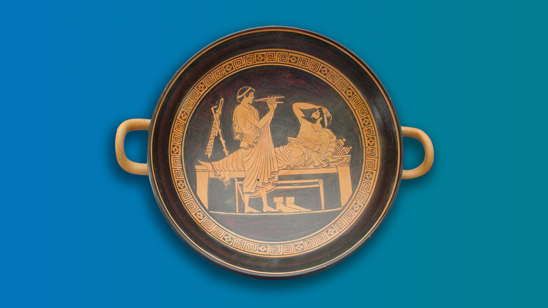 A brown and orange bowl with two handles depicting a man playing an instrument and another laying down on a gradient background