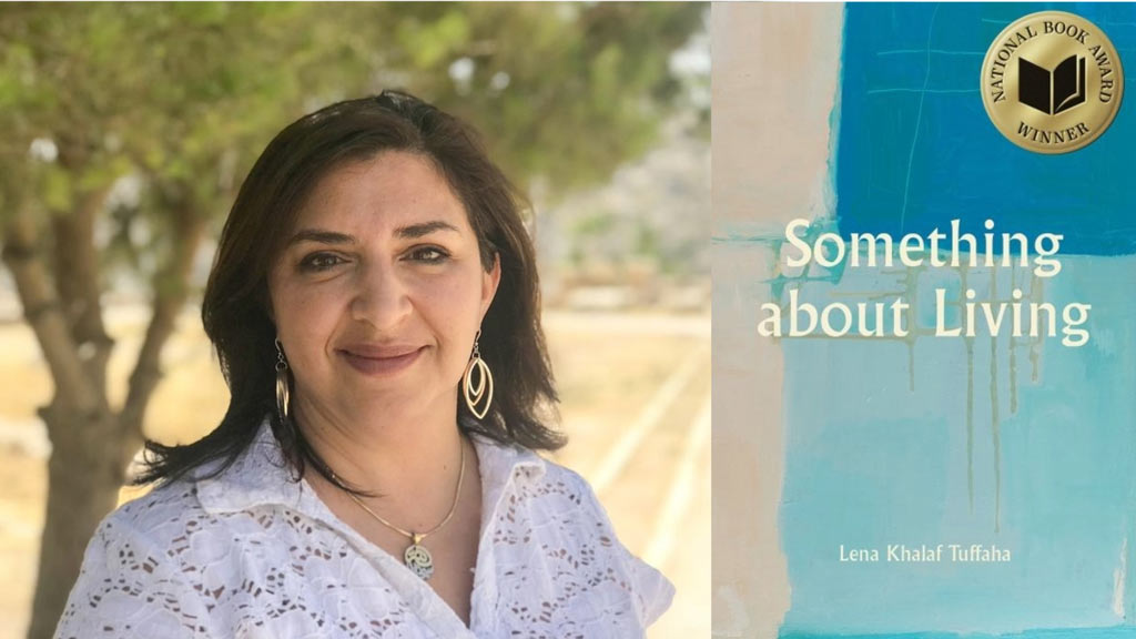 Woman standing in front of a tree overlooking a field with her book cover next to her