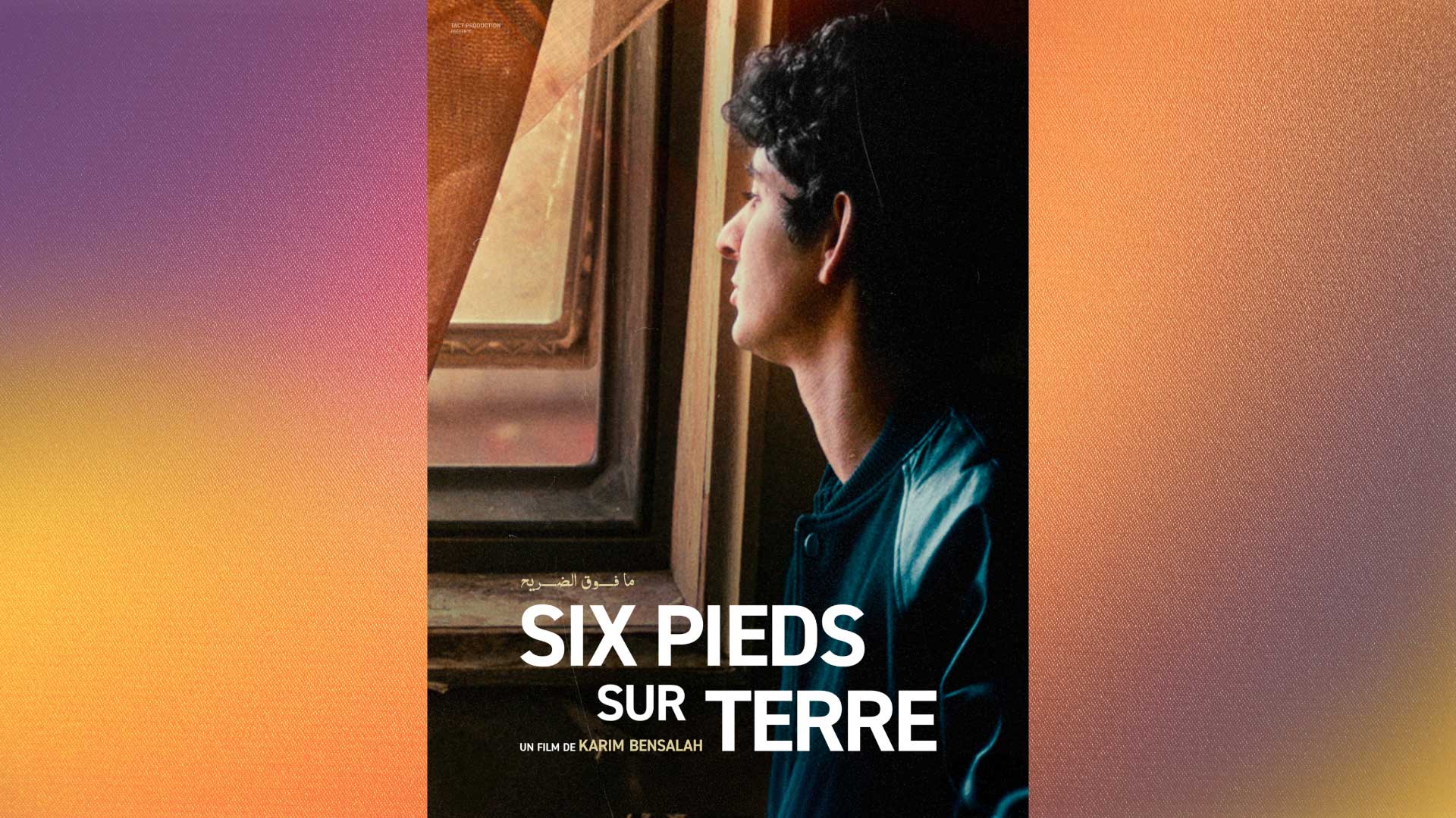 Dramatically lit side portrait of a person with dark hair looking toward art comprised of concentric picture frames