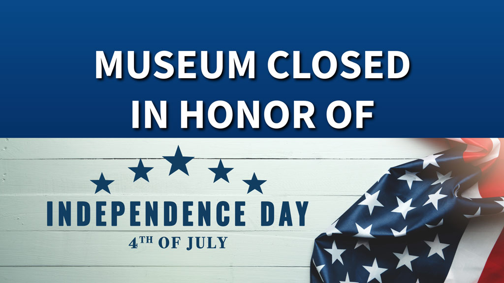 'Independence day' written in blue letters on a white background with the American flag next to it