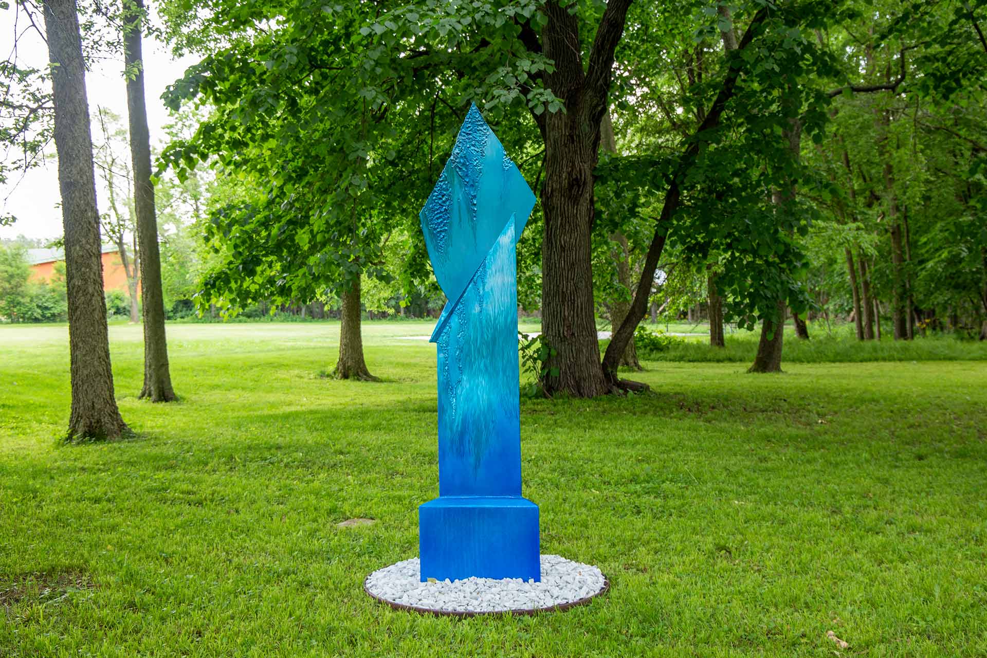Side-view of a blue icicle on the ground