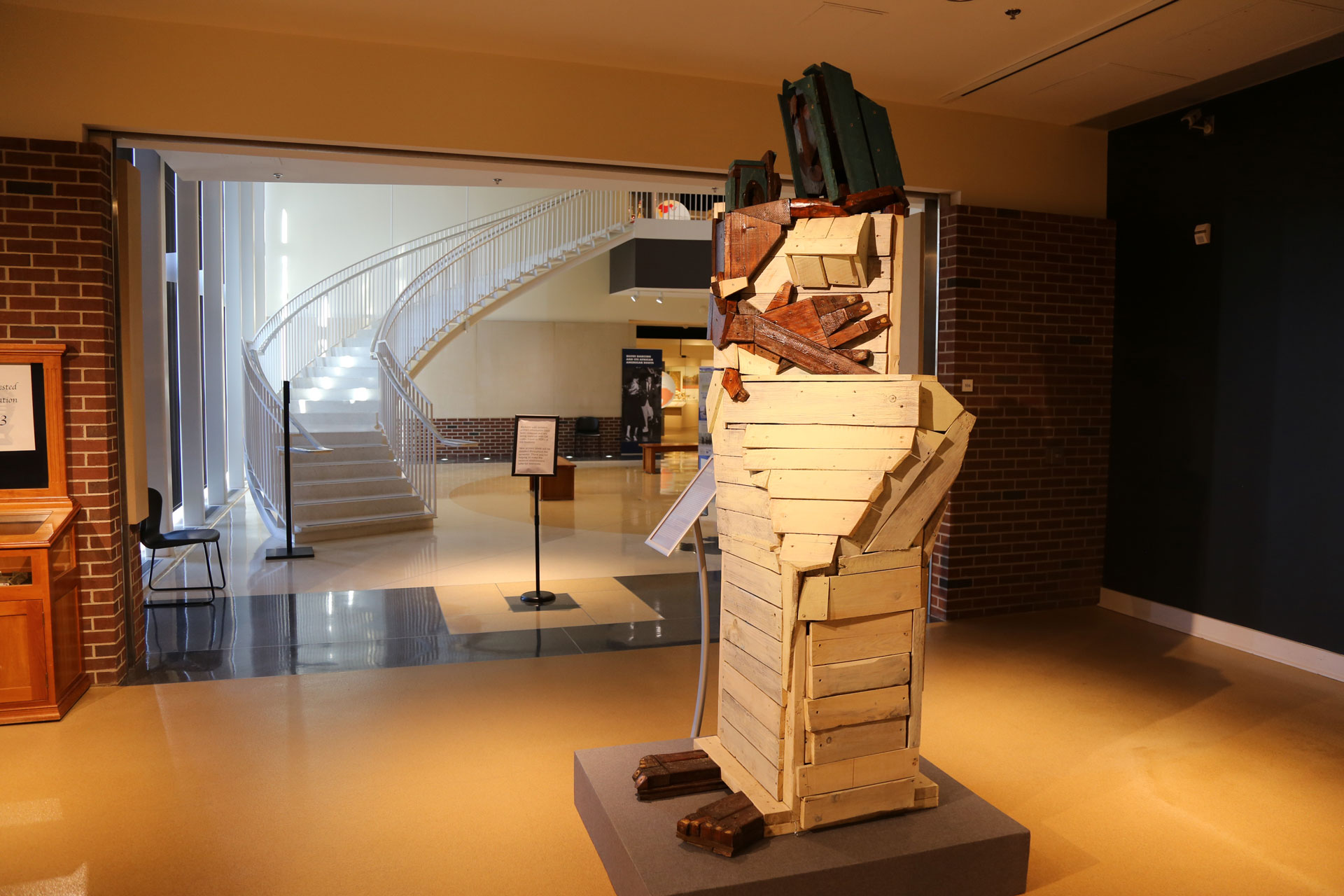 A side, further view of the Mother and Child artwork with the center lobby of Spurlock in the background