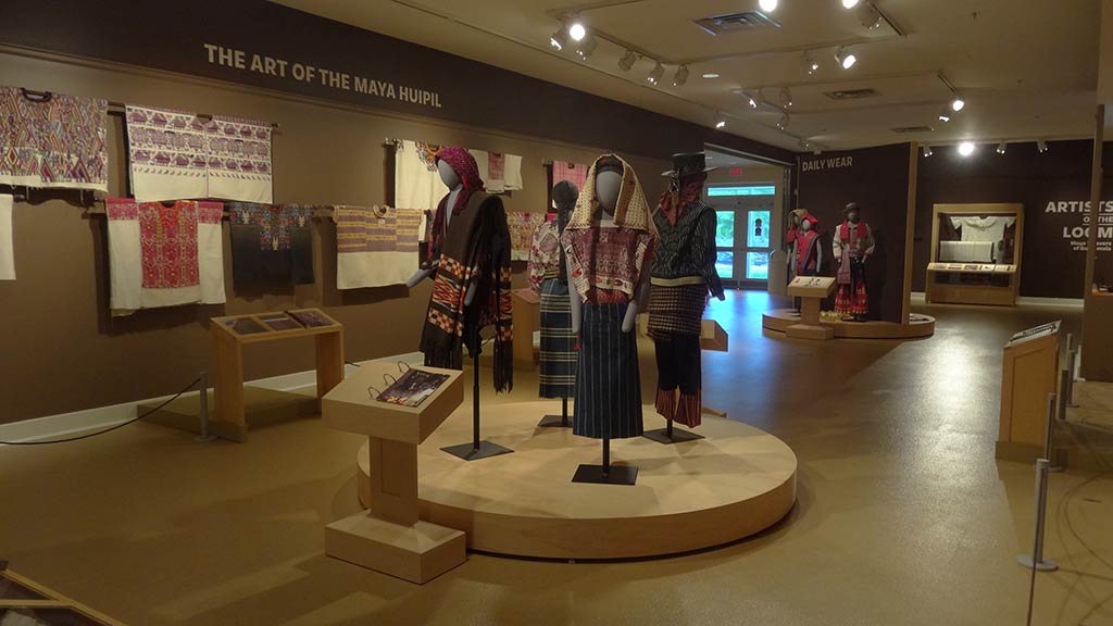 overview of the gallery with Maya clothing on models as the focus, with other Maya clothing in the background