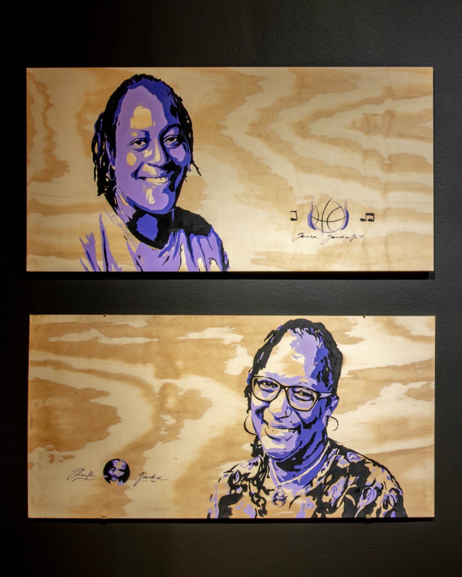 Two wooden canvases with portrais of Black women in three shades of purple