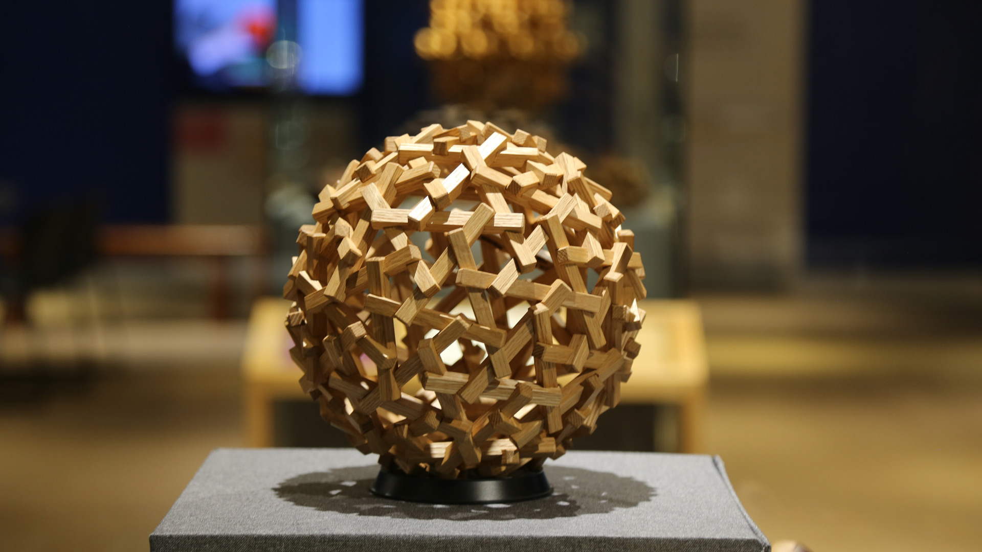 closeup of wood sphere puzzle