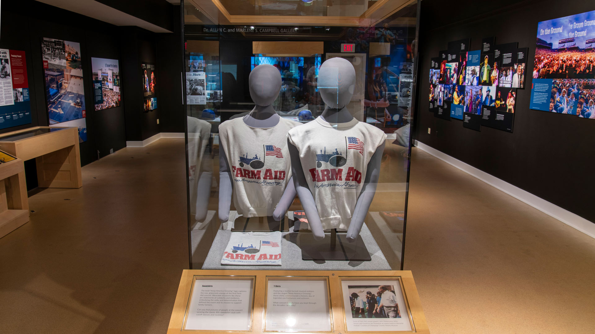 outdoor concert venue with Farm Aid signs and a sea of people