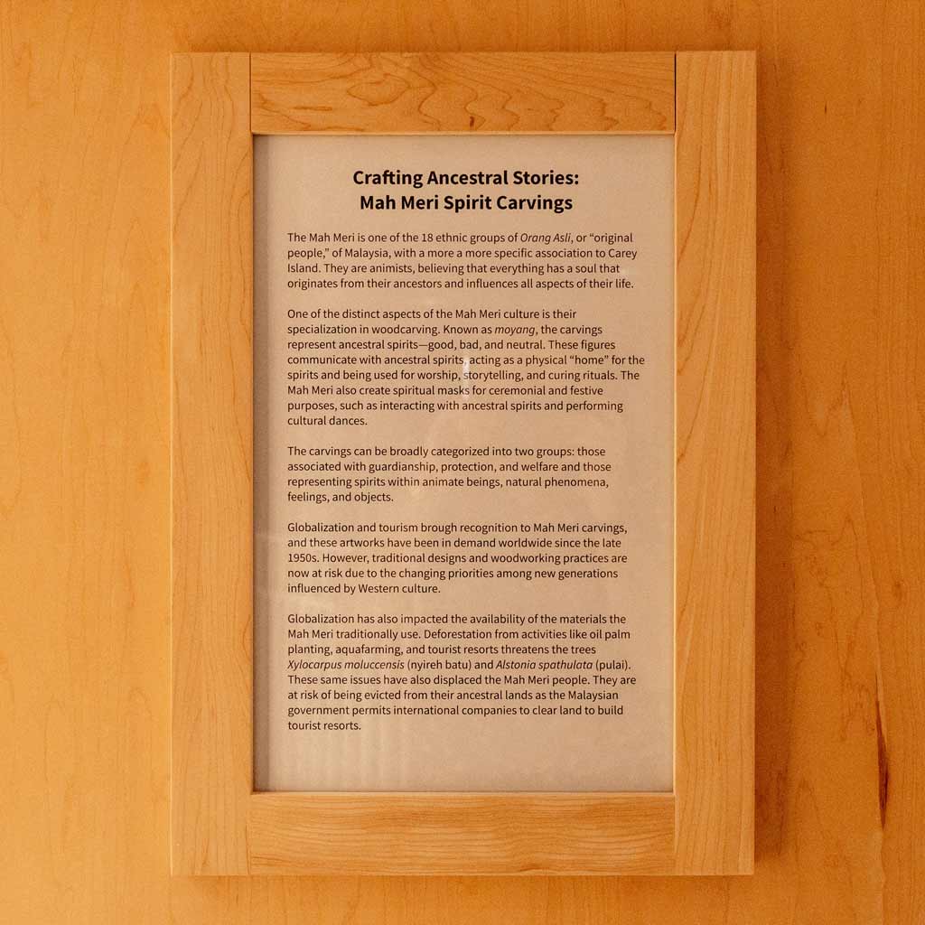 A plaque describing the crafting process of the woodcarvings