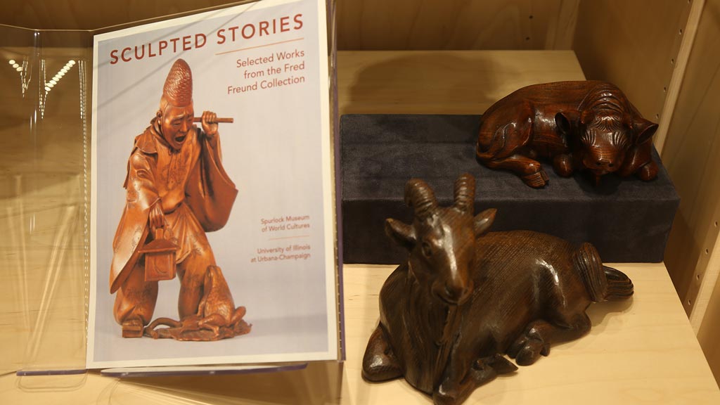 shot of two sculpted animals next to the 'sculpted stories' book