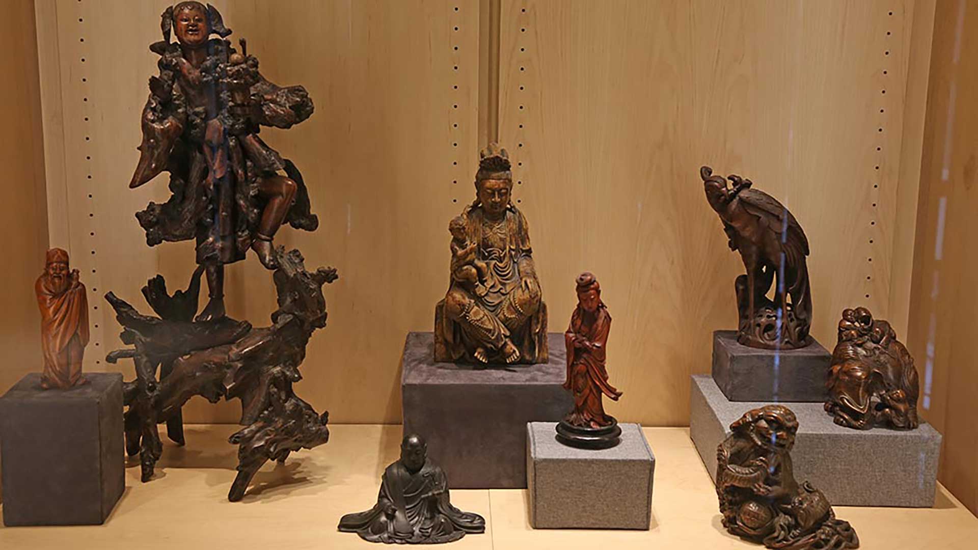a shot that shows the many sculptures in one display case